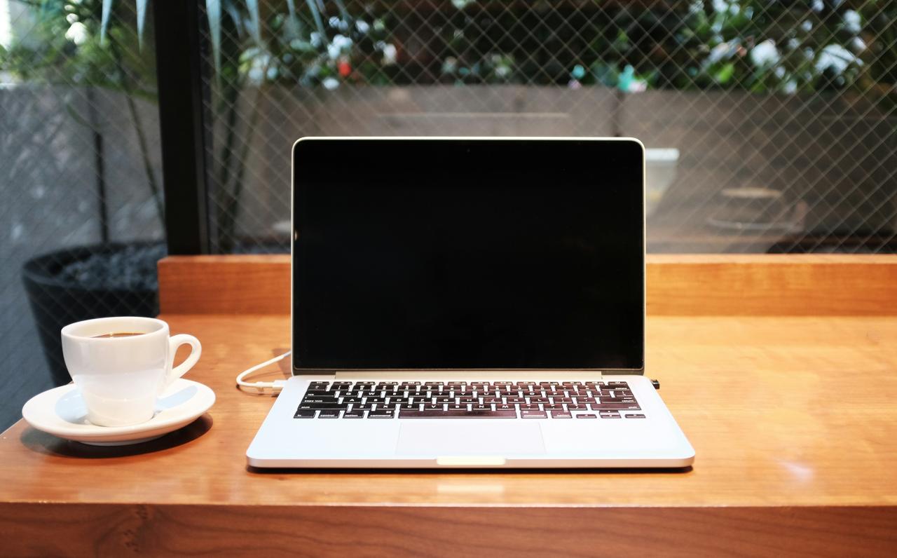 A person researching health insurance options on a laptop